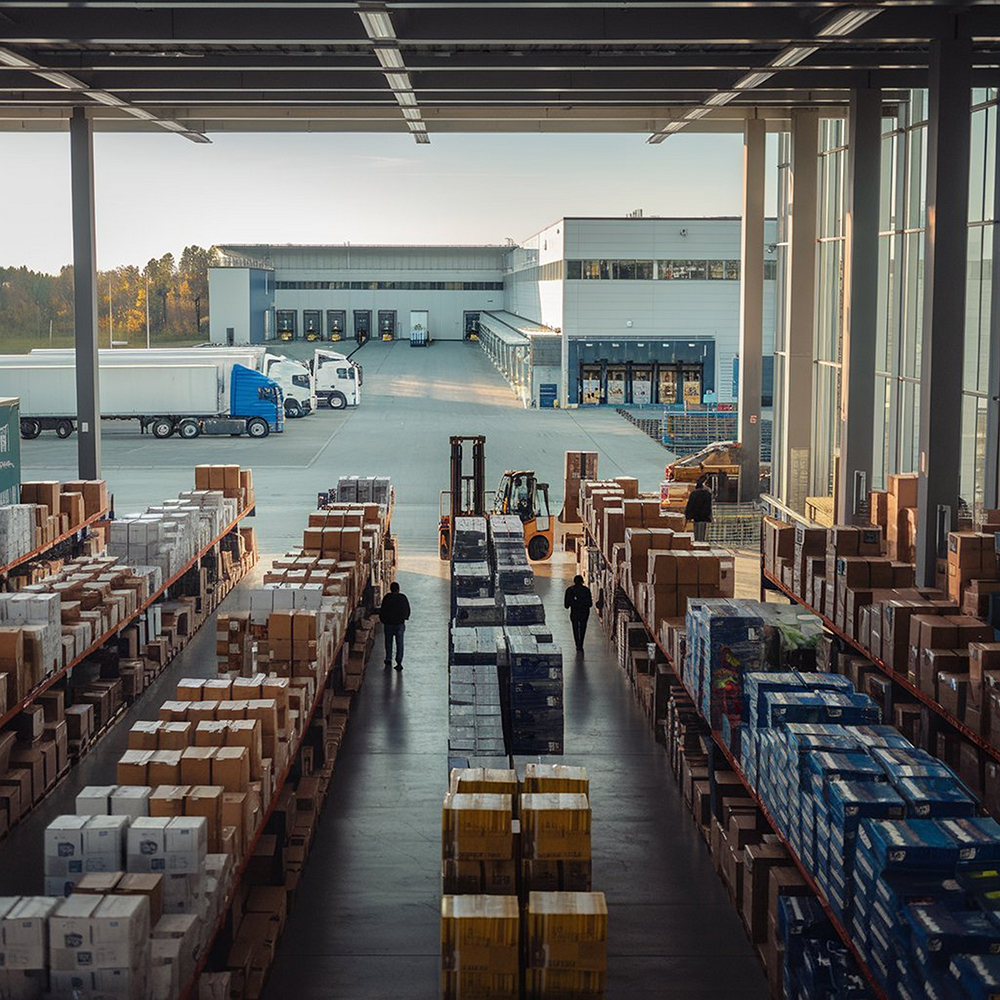 Retail warehouse full shelves with goods cartonslogistics transportation blurred background