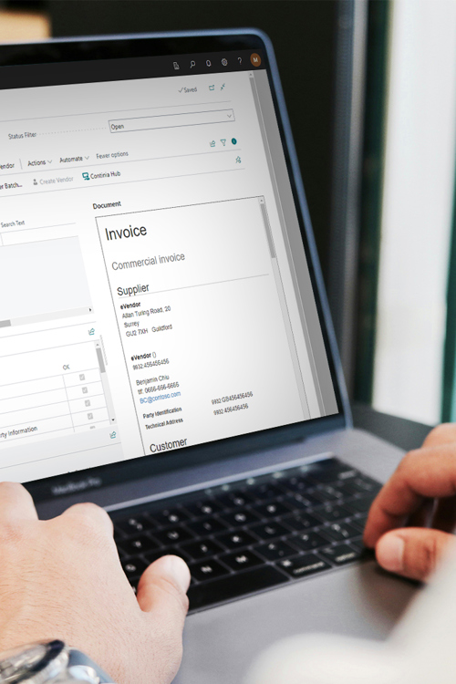 Person sitting at laptop with business central e invoice